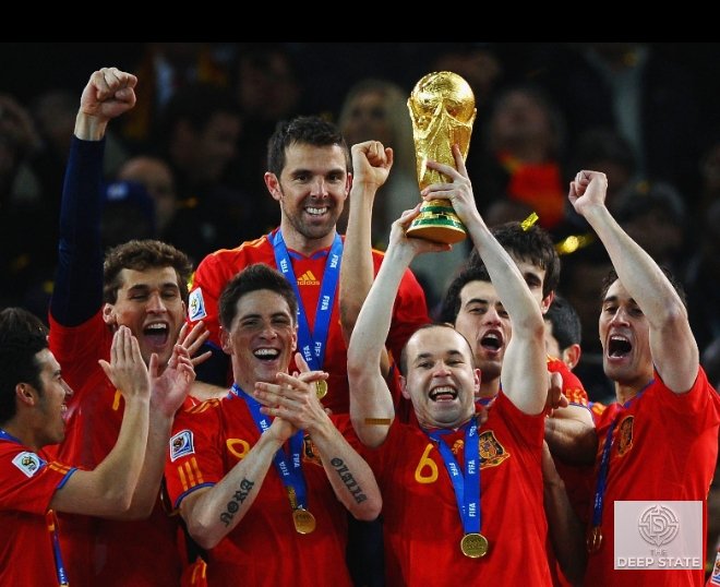 Spain captain lifts the FIFA World Cup trophy as teammates celebrate their historic triumph